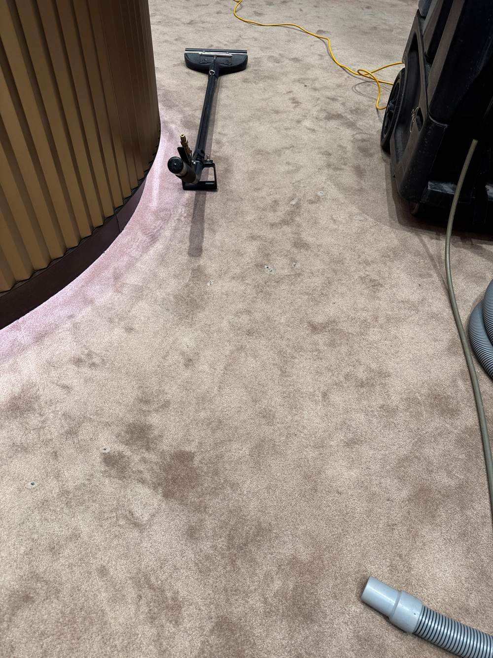 commercial carpet cleaning Gold Coast, wand and portable machine on a natural fibre carpet in a luxury retail store CPH Services Gold Coast